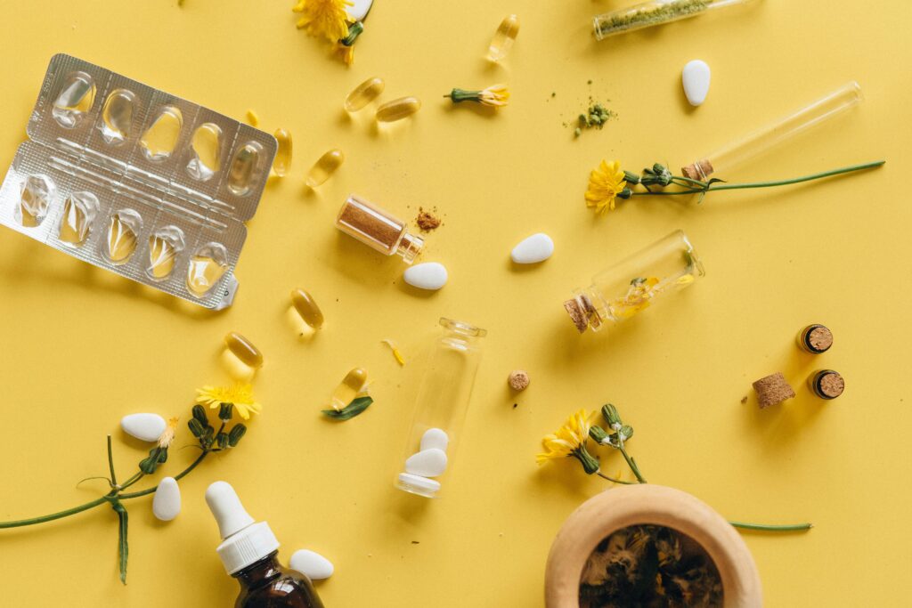 pexels photo 7526051 7526051 Herbal supplements and medicine capsules on a vibrant yellow background for health themes.